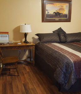 bed and nightstand at sage cottage 406